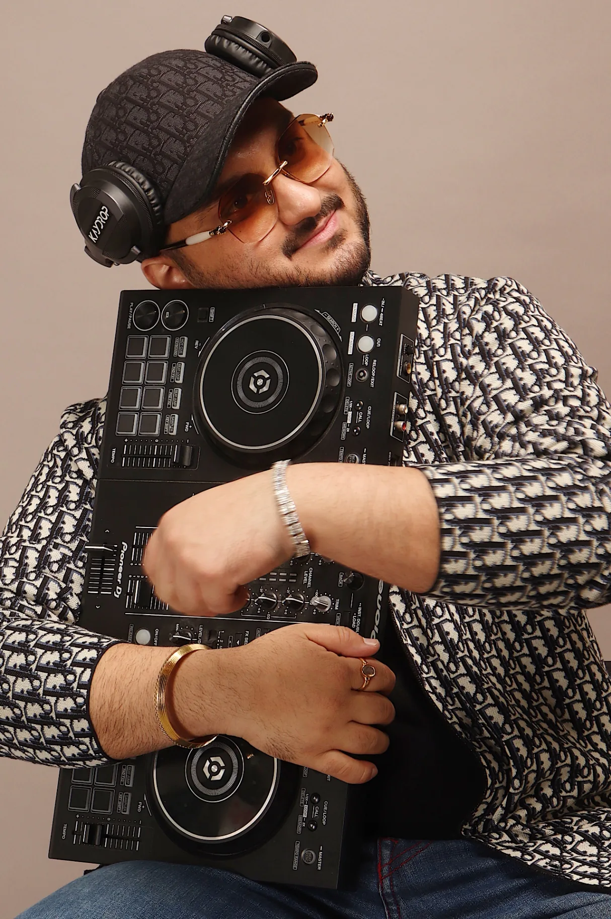 Tonu close-up with his Pioneer DDJ controller and signature headphones.